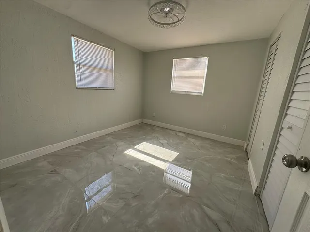 a view of empty room with windows