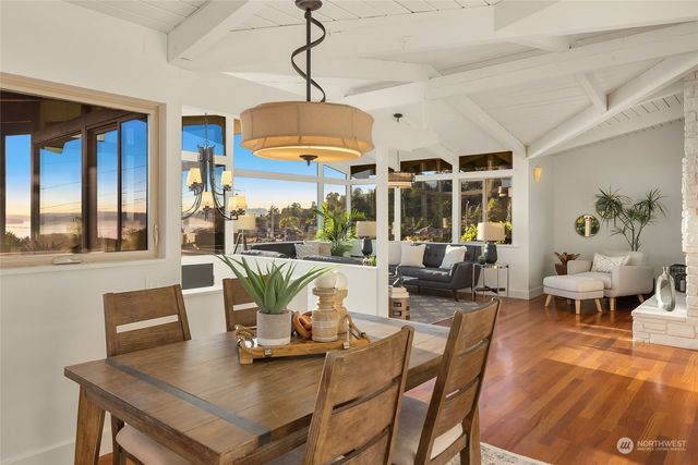 a view of a dining room with furniture window and outside view