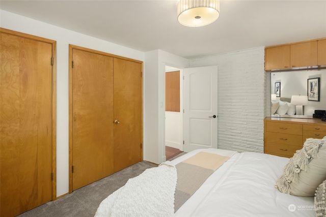 a bedroom with a bed and a sink