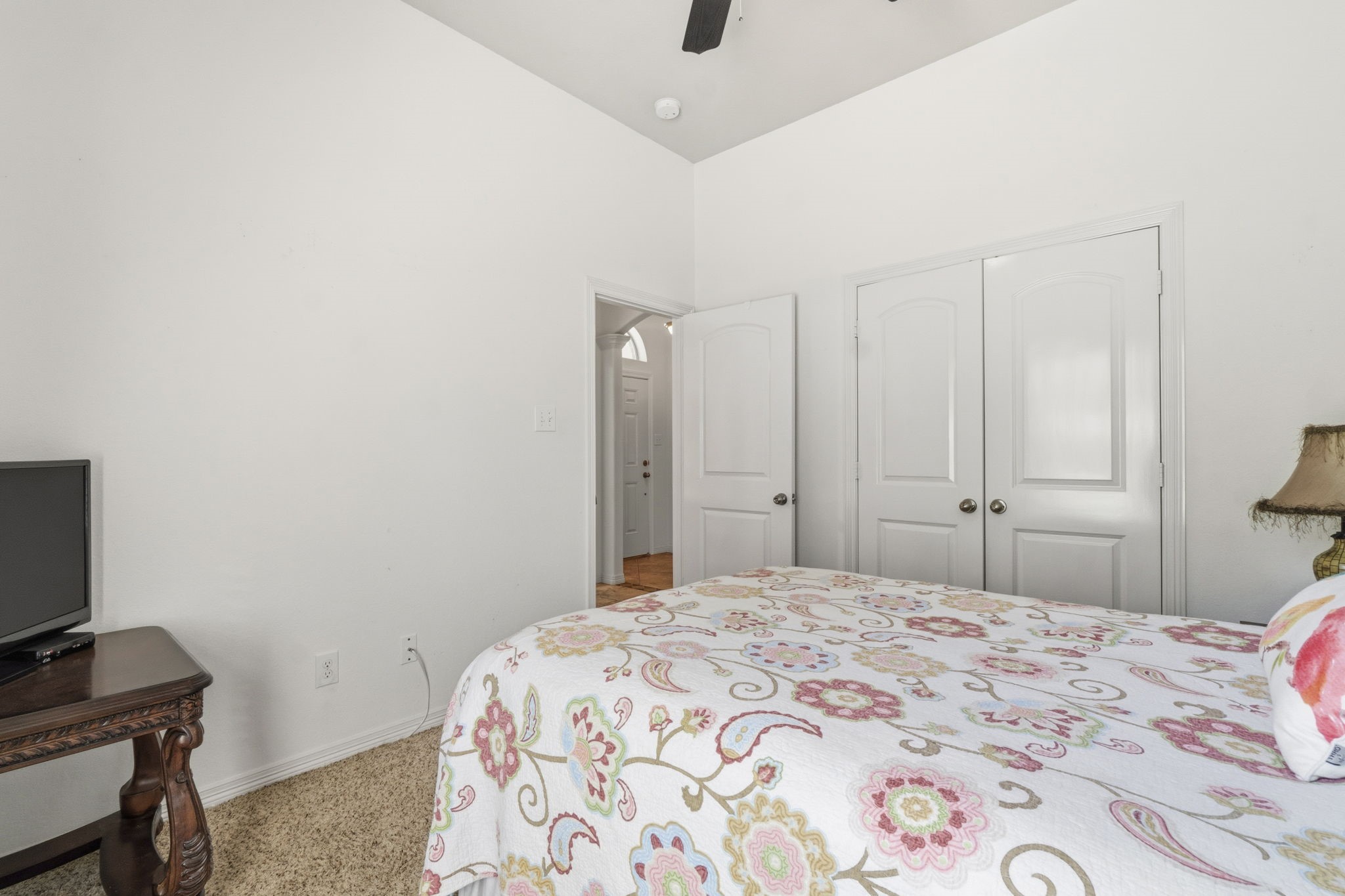 10802 Windswept Montgomery, TX 77356 - Photo 19 of 42 a bedroom with a bed and a flat screen tv