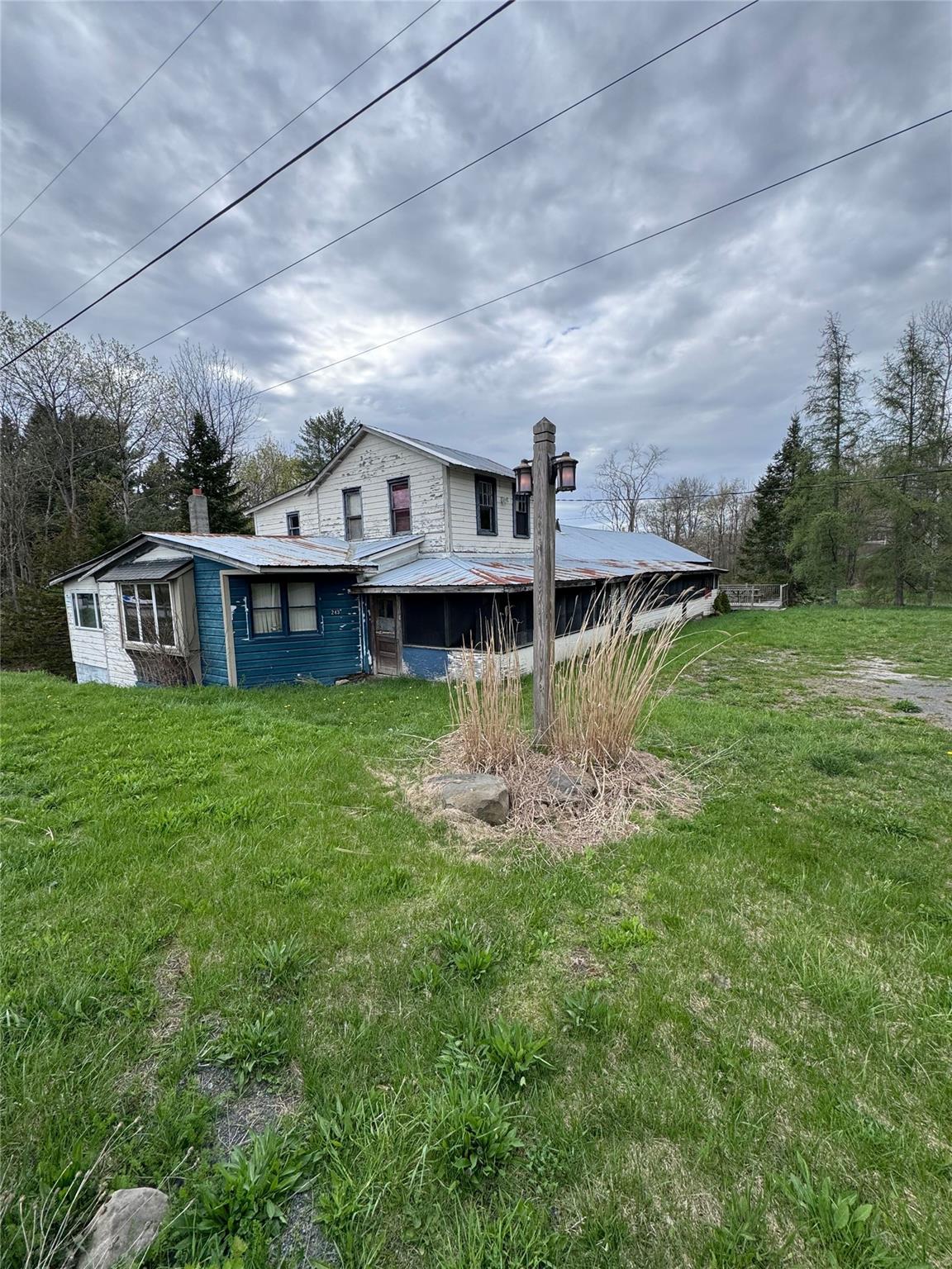243 Lake Road Berne, NY 12023 - Photo 1 of 1 a view of a house with a big yard and a large tree
