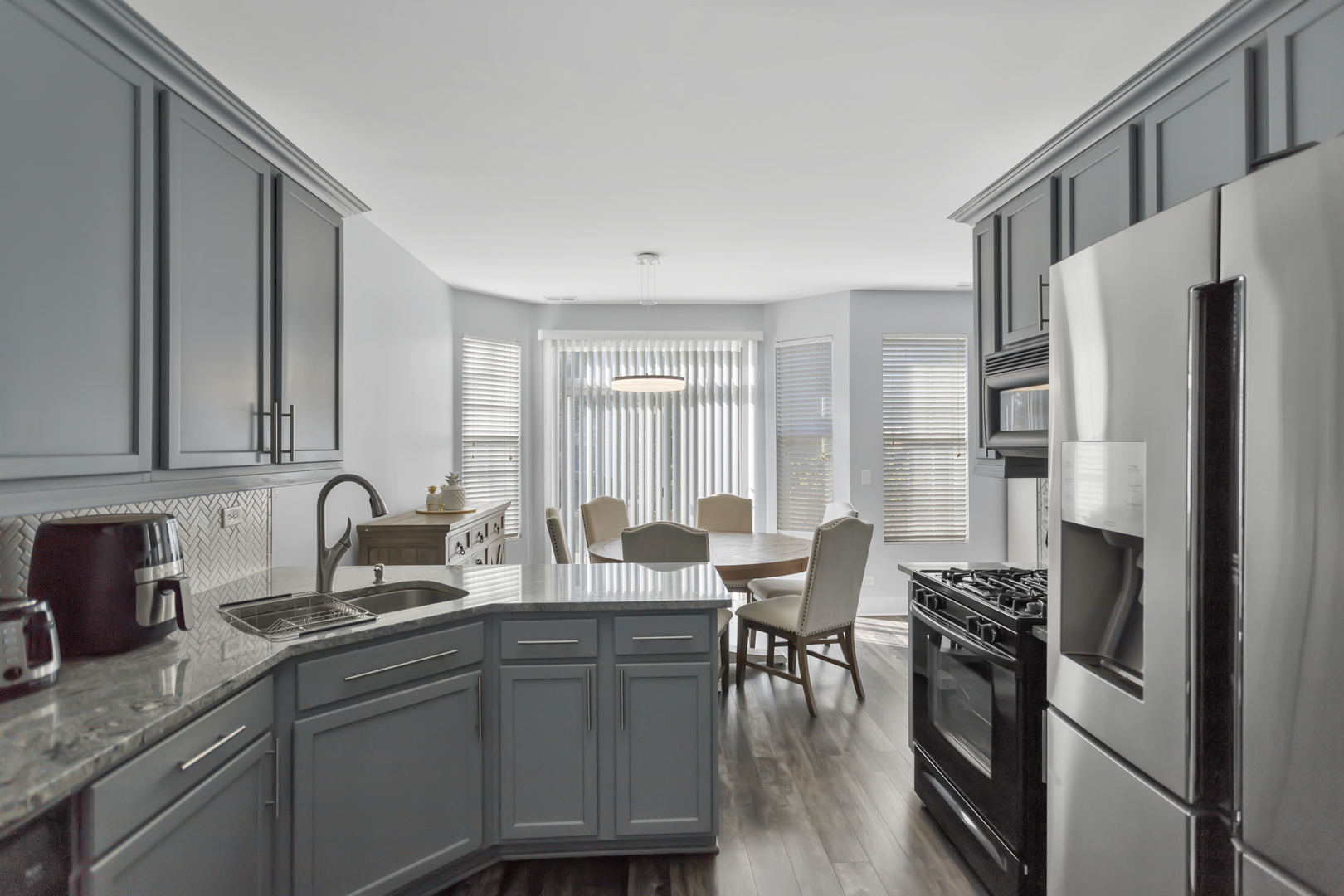 1420 Millbrook Drive Algonquin, IL 60102 - Photo 12 of 28 a kitchen with stainless steel appliances granite countertop a sink stove and refrigerator