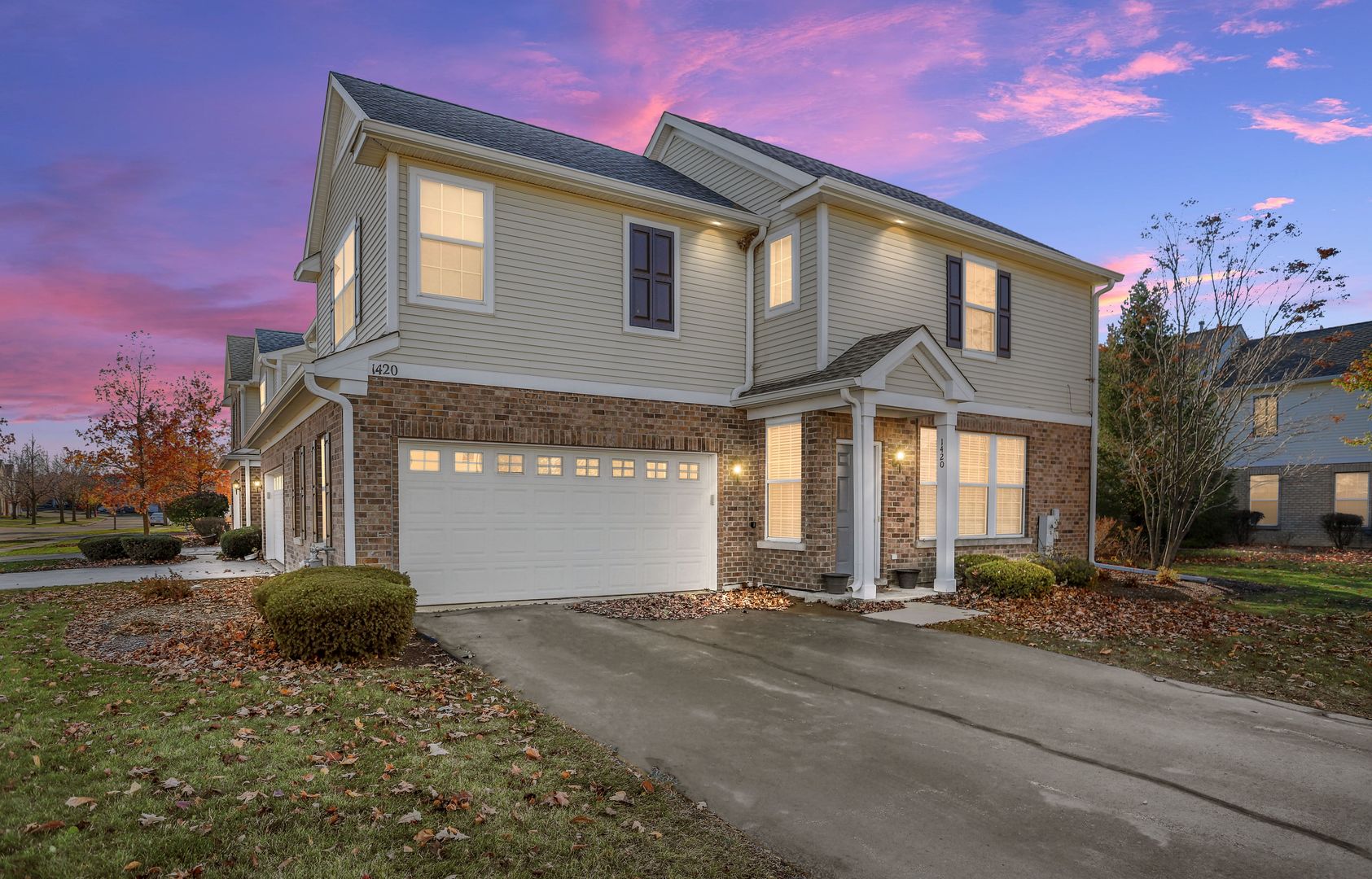 1420 Millbrook Drive Algonquin, IL 60102 - Photo 2 of 28 a front view of a house with a yard and garage