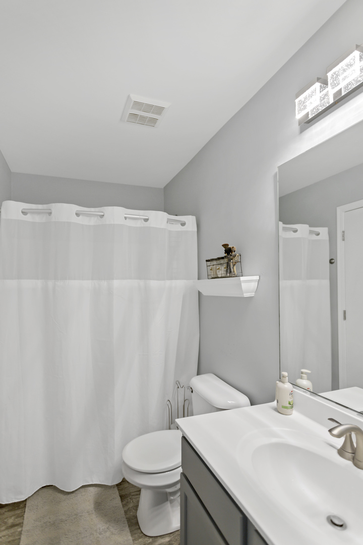 1420 Millbrook Drive Algonquin, IL 60102 - Photo 24 of 28 a bathroom with a sink toilet and vanity