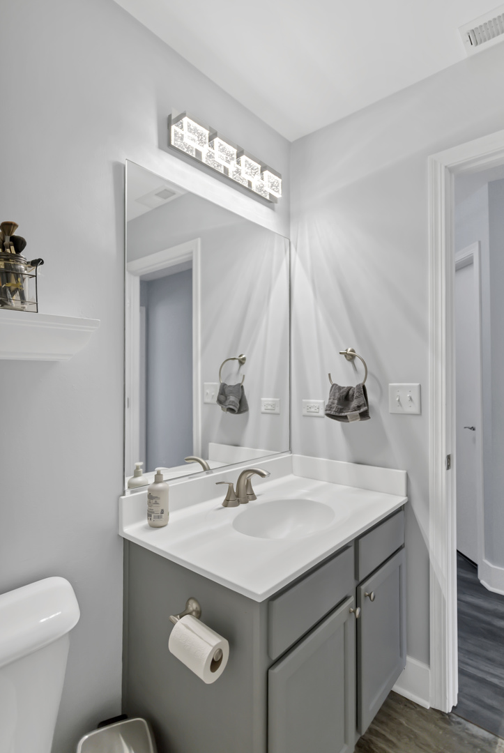 1420 Millbrook Drive Algonquin, IL 60102 - Photo 25 of 28 a bathroom with a sink and a mirror