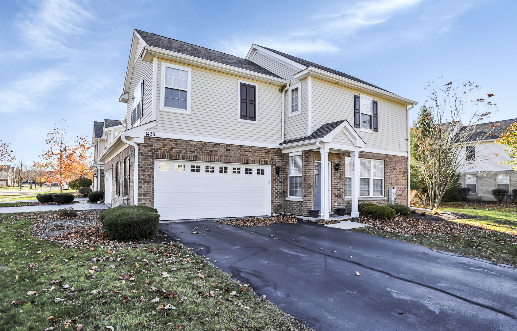 1420 Millbrook Drive Algonquin, IL 60102 - Photo 3 of 28 a front view of a house with a yard and garage