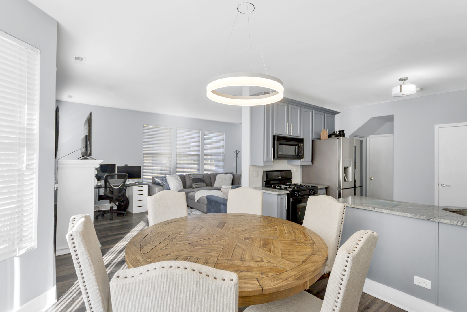 1420 Millbrook Drive Algonquin, IL 60102 - Photo 9 of 28 a living room with stainless steel appliances furniture a fireplace and a kitchen view