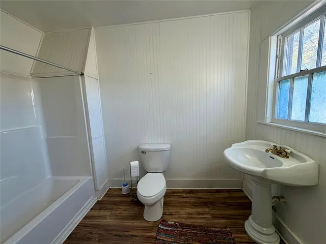 a living room with furniture window and a fireplace