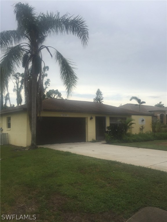 18566 Wisteria Road Fort Myers, FL 33967 - Photo 1 of 15 a front view of house with yard and outdoor seating
