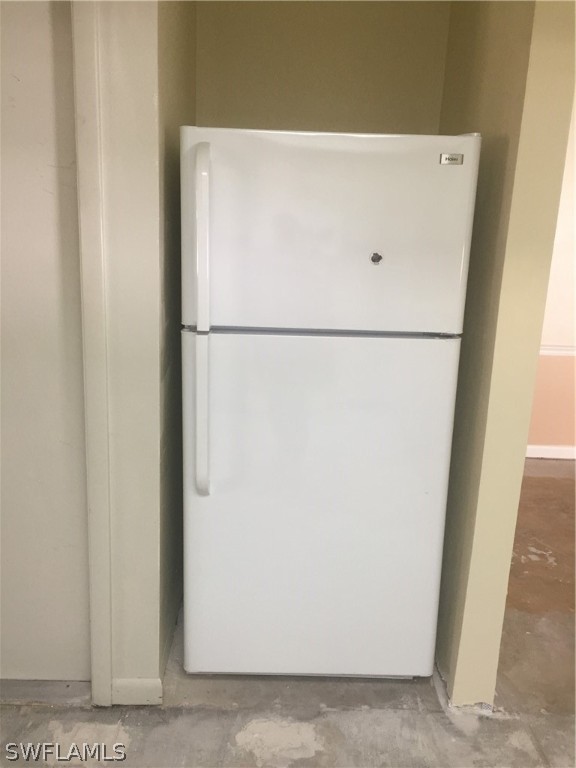 18566 Wisteria Road Fort Myers, FL 33967 - Photo 13 of 15 a white refrigerator freezer sitting next to a white wall