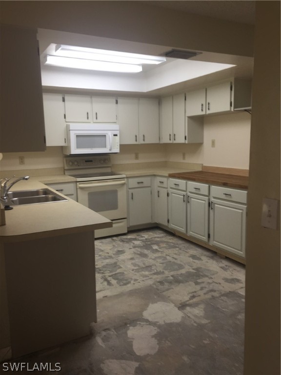 18566 Wisteria Road Fort Myers, FL 33967 - Photo 15 of 15 a kitchen with a sink cabinets and wooden floor