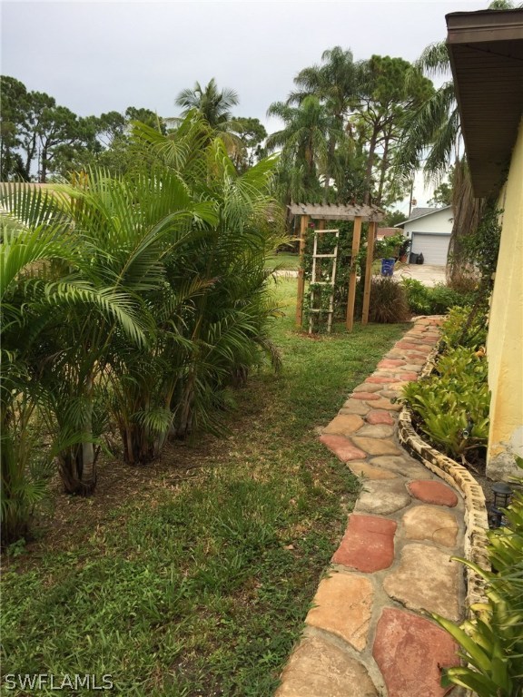 18566 Wisteria Road Fort Myers, FL 33967 - Photo 2 of 15 a view of backyard with green space