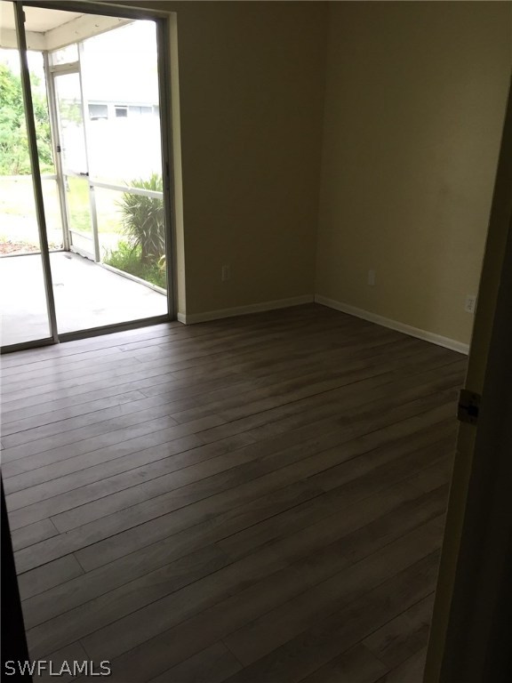 18566 Wisteria Road Fort Myers, FL 33967 - Photo 4 of 15 a view of wooden floor and windows in an empty room