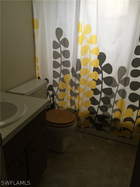 18566 Wisteria Road Fort Myers, FL 33967 - Photo 5 of 15 a bathroom with a sink toilet and shower