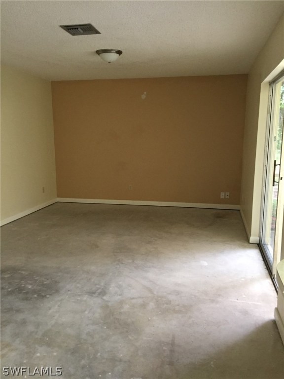 18566 Wisteria Road Fort Myers, FL 33967 - Photo 8 of 15 an empty room with a window
