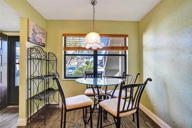 a kitchen with a stove a sink and a microwave