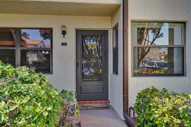 a view of hallway with wooden floor