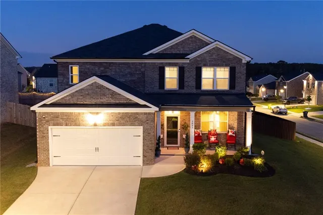 a front view of a house with yard