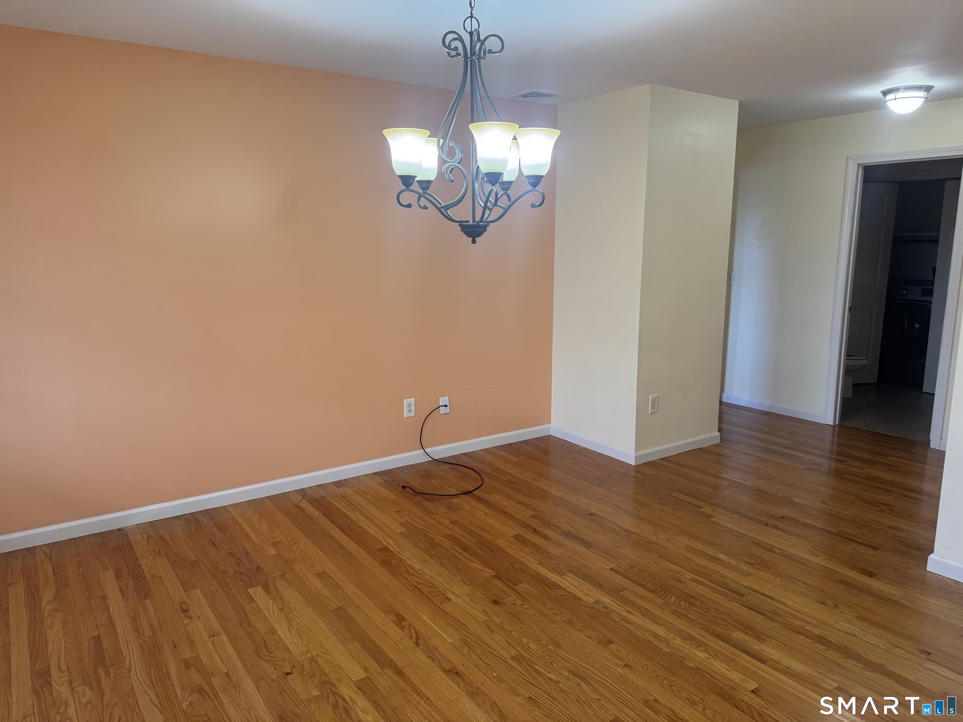 32 Tyler Hill Road Naugatuck, CT 06770 - Photo 12 of 27 a view of an empty room with wooden floor and a window