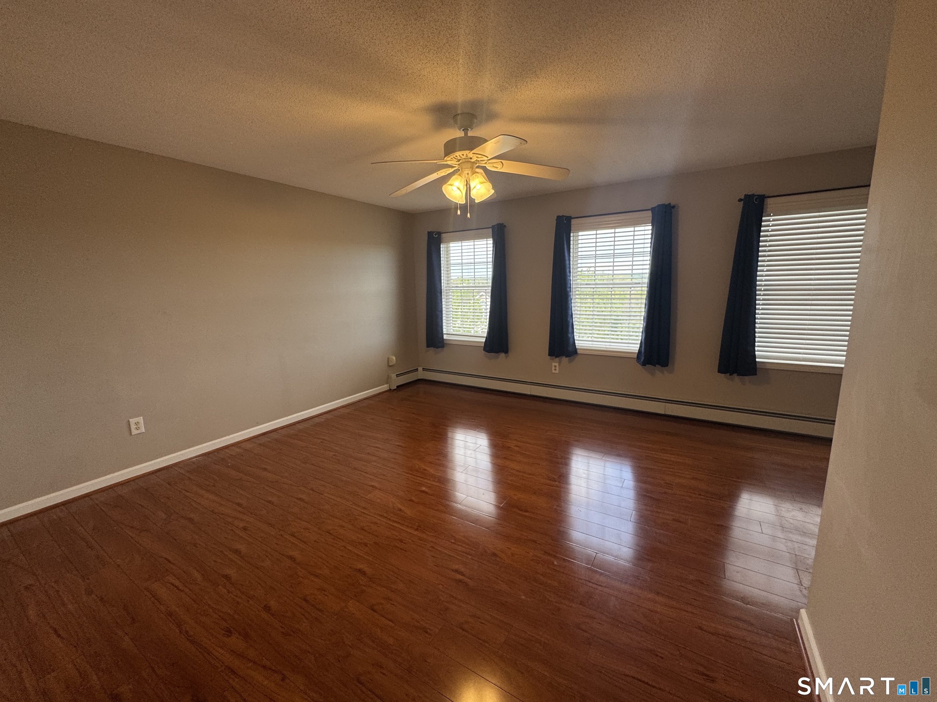 32 Tyler Hill Road Naugatuck, CT 06770 - Photo 23 of 27 a view of an empty room with wooden floor and a window