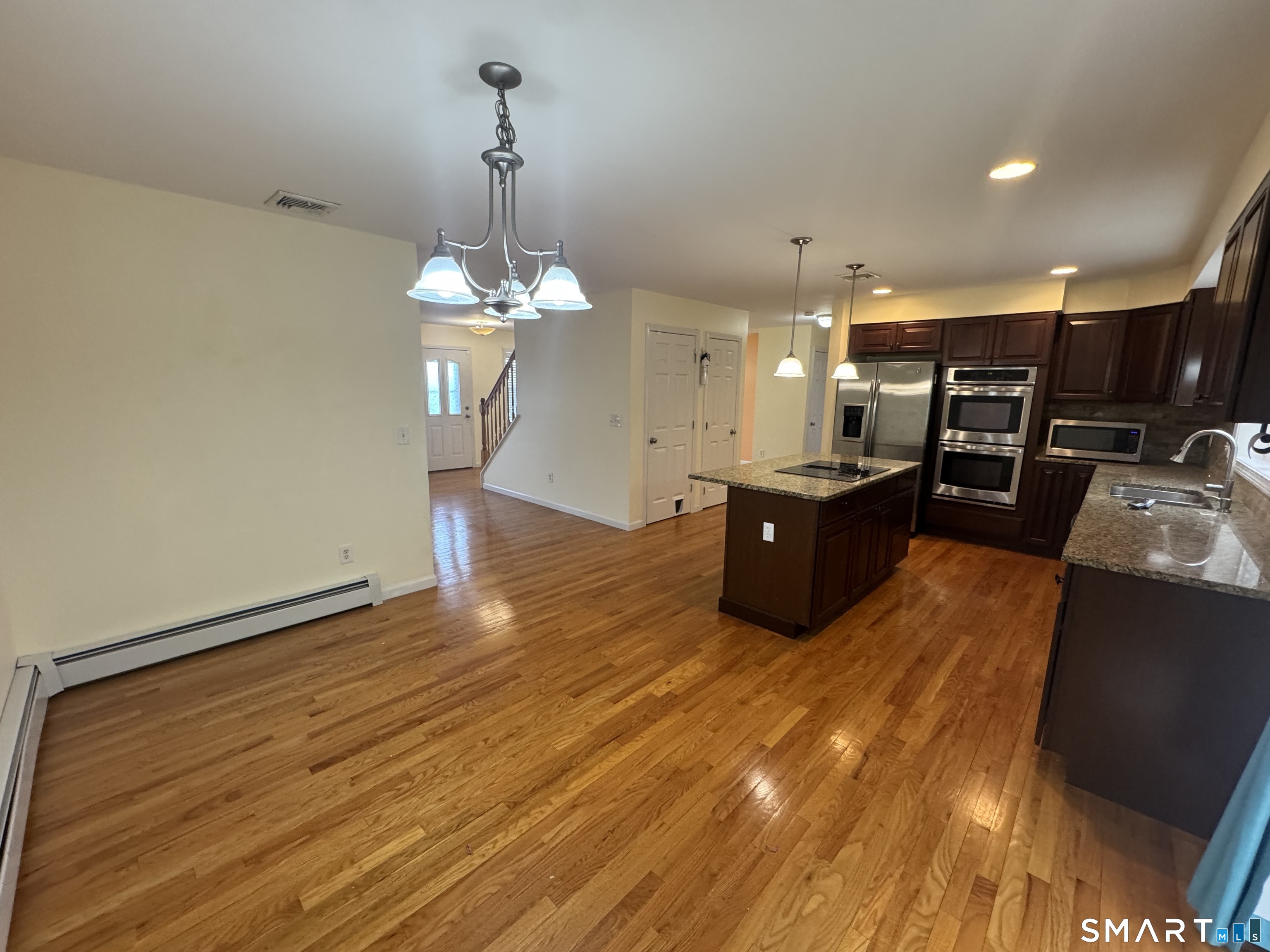 32 Tyler Hill Road Naugatuck, CT 06770 - Photo 4 of 27 a living room with hard wood floors and a ceiling fan