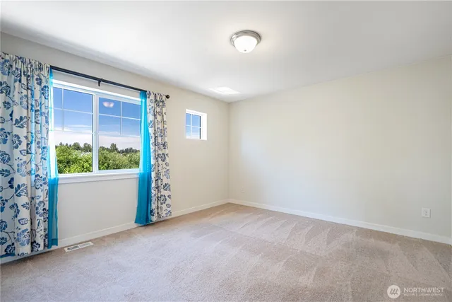 a view of a hallway with washer and dryer