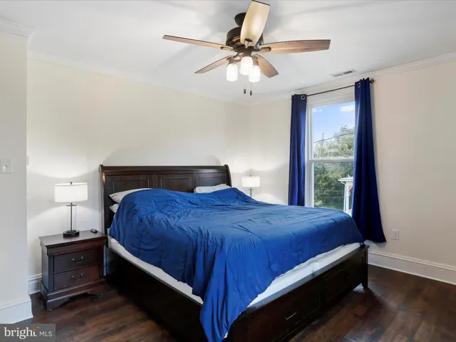 a bedroom with a bed and window