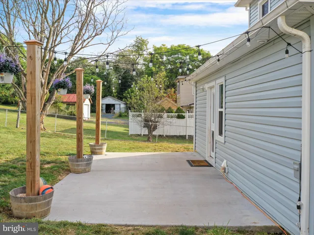 a view of backyard with swimming pool