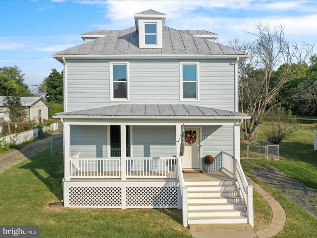 a view of a house with a roof deck