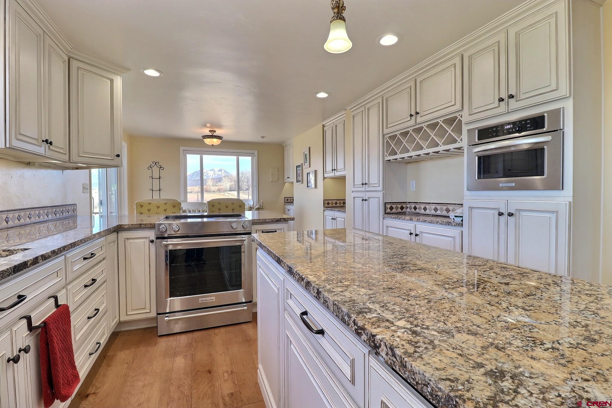 36557 Grandview Mesa Road Crawford, CO 81415 - Photo 11 of 45 a kitchen with stainless steel appliances granite countertop a stove and a sink