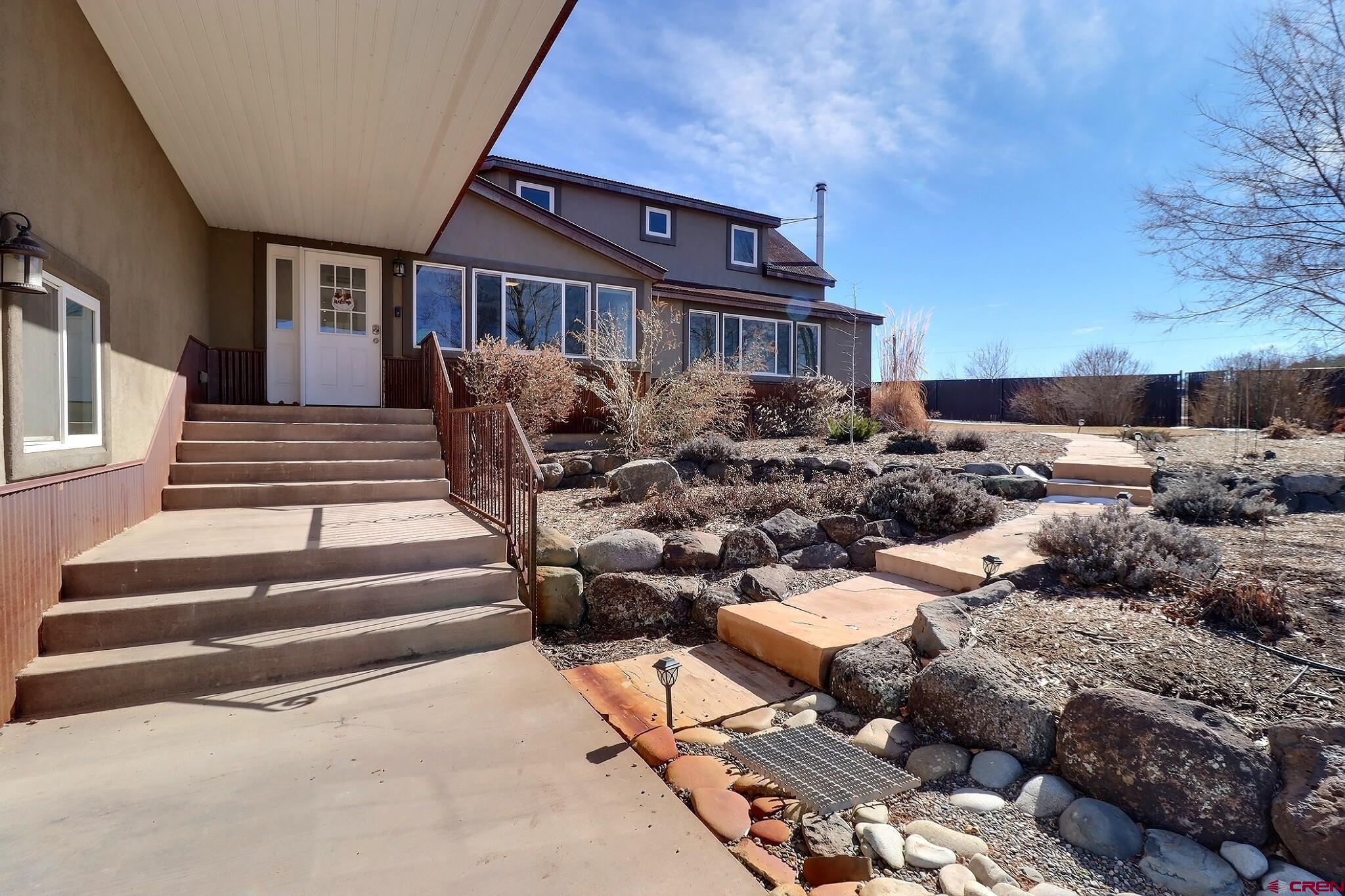 36557 Grandview Mesa Road Crawford, CO 81415 - Photo 2 of 45 a view of a house with backyard and porch
