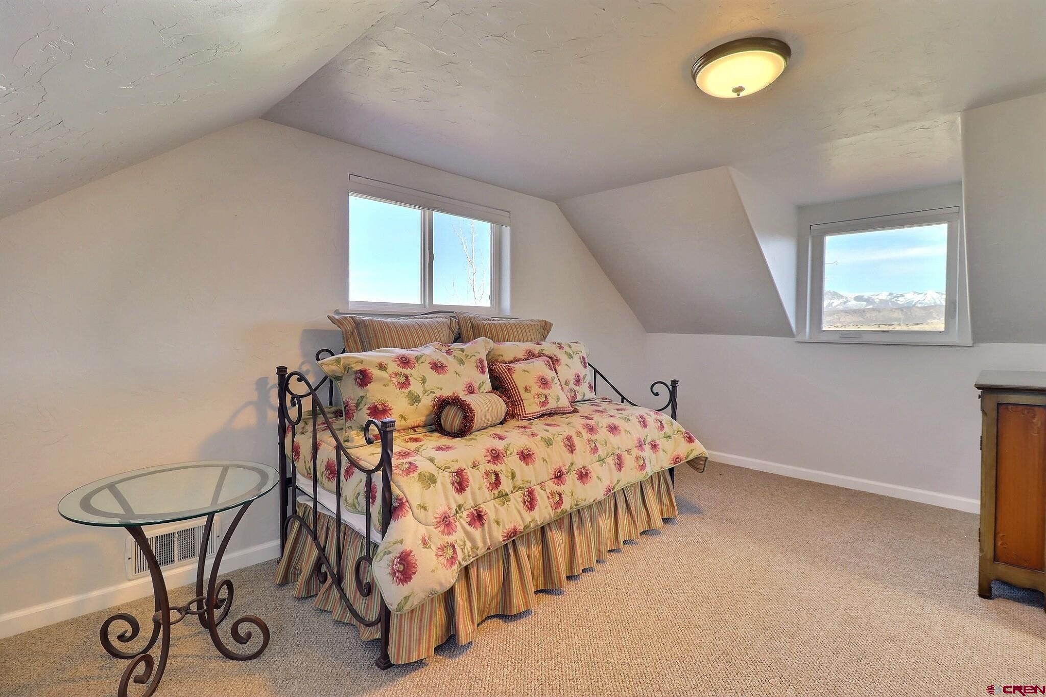 36557 Grandview Mesa Road Crawford, CO 81415 - Photo 22 of 45 a bedroom with bed and a window