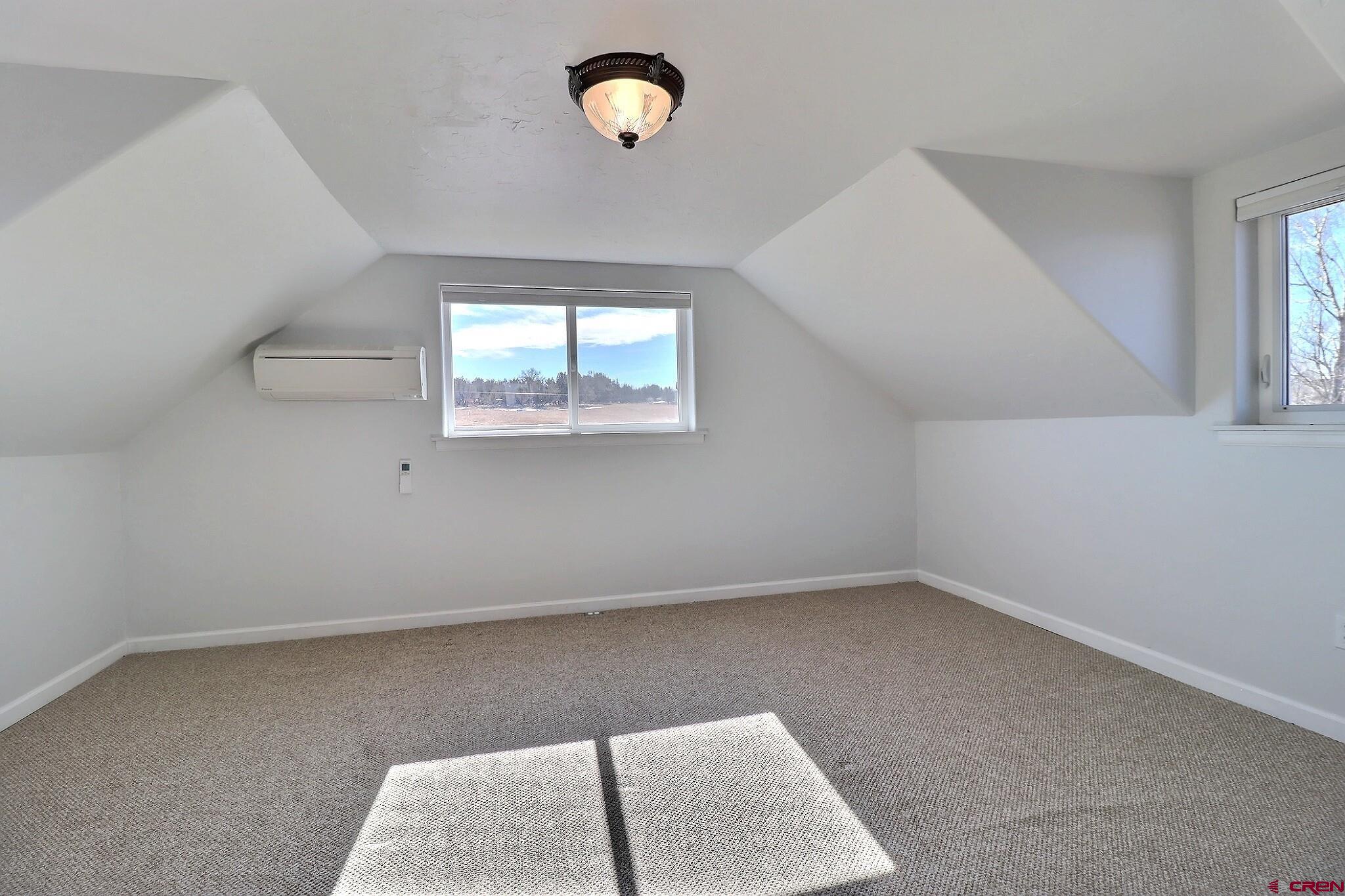 36557 Grandview Mesa Road Crawford, CO 81415 - Photo 25 of 45 an empty room with windows