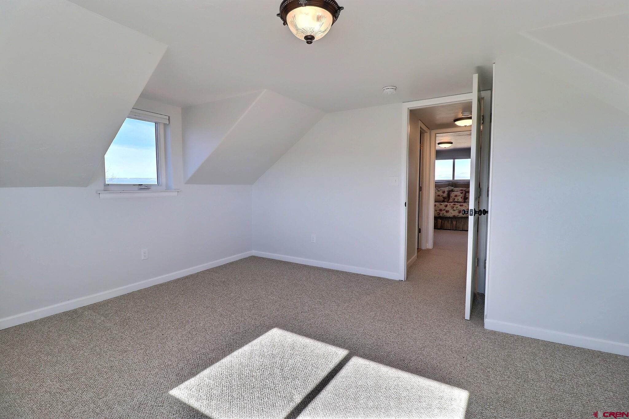 36557 Grandview Mesa Road Crawford, CO 81415 - Photo 26 of 45 an empty room with windows