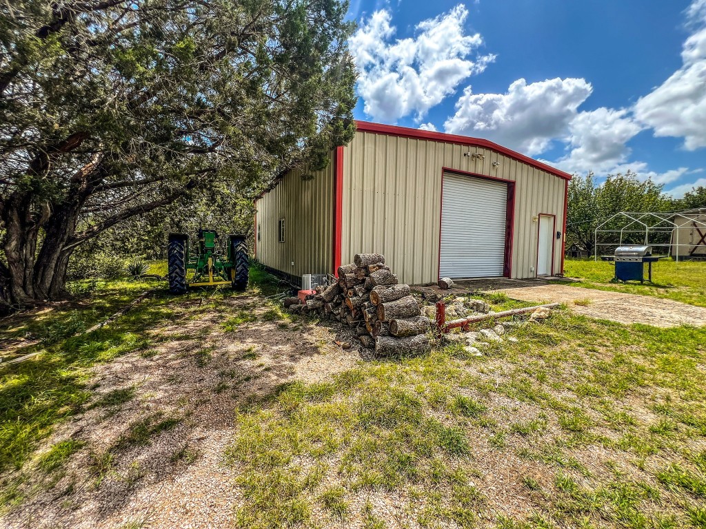 1220 County Road 225 Briggs, TX 78608 - Photo 12 of 36 a view of a house with backyard and sitting area
