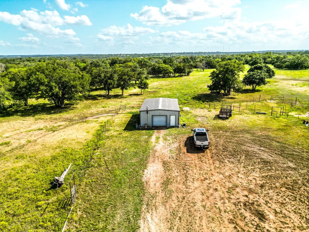 1220 County Road 225 Briggs, TX 78608 - Photo 17 of 36 a view of a swimming pool with an outdoor seating