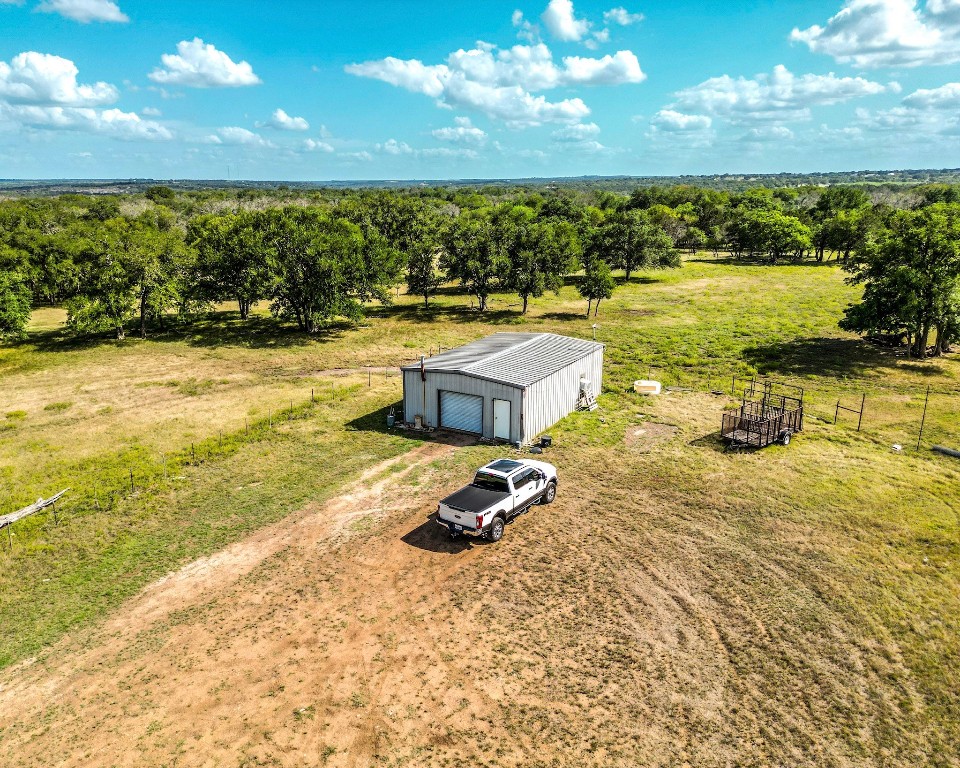 1220 County Road 225 Briggs, TX 78608 - Photo 18 of 36 a view of a swimming pool with an ocean