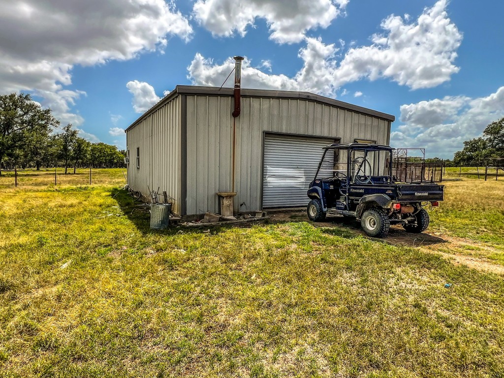 1220 County Road 225 Briggs, TX 78608 - Photo 19 of 36 a view of a house with backyard