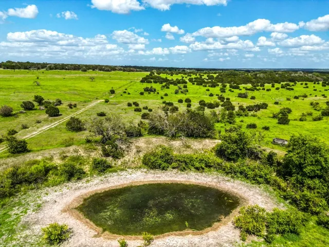 a view of a lake with a building in the background