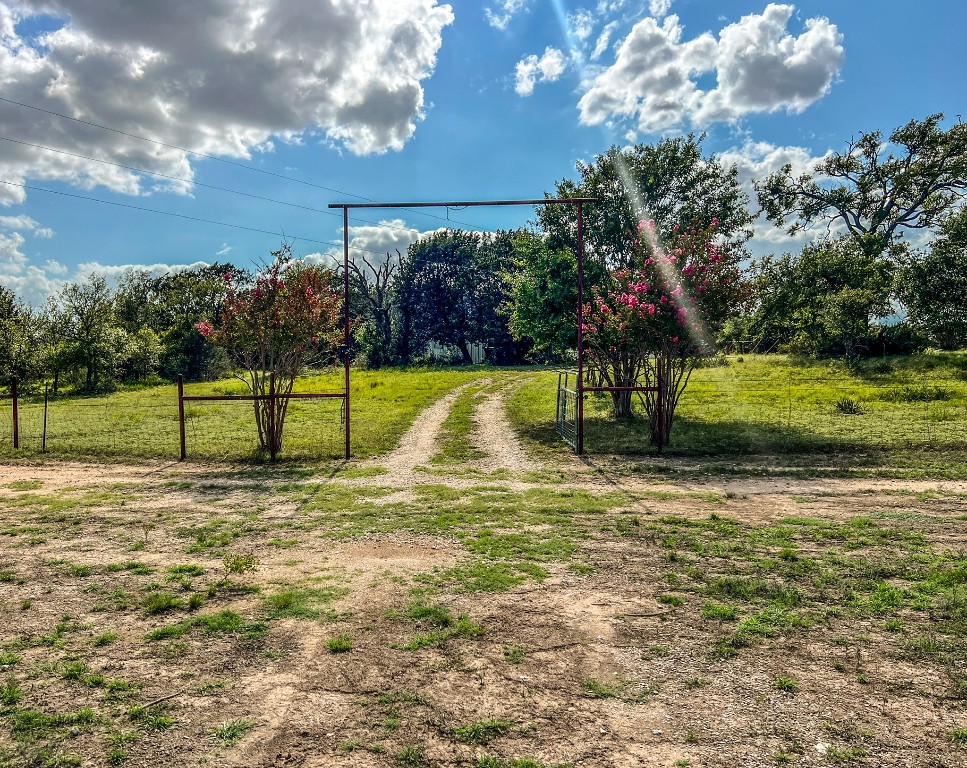 1220 County Road 225 Briggs, TX 78608 - Photo 9 of 36 a view of a playground with basketball court