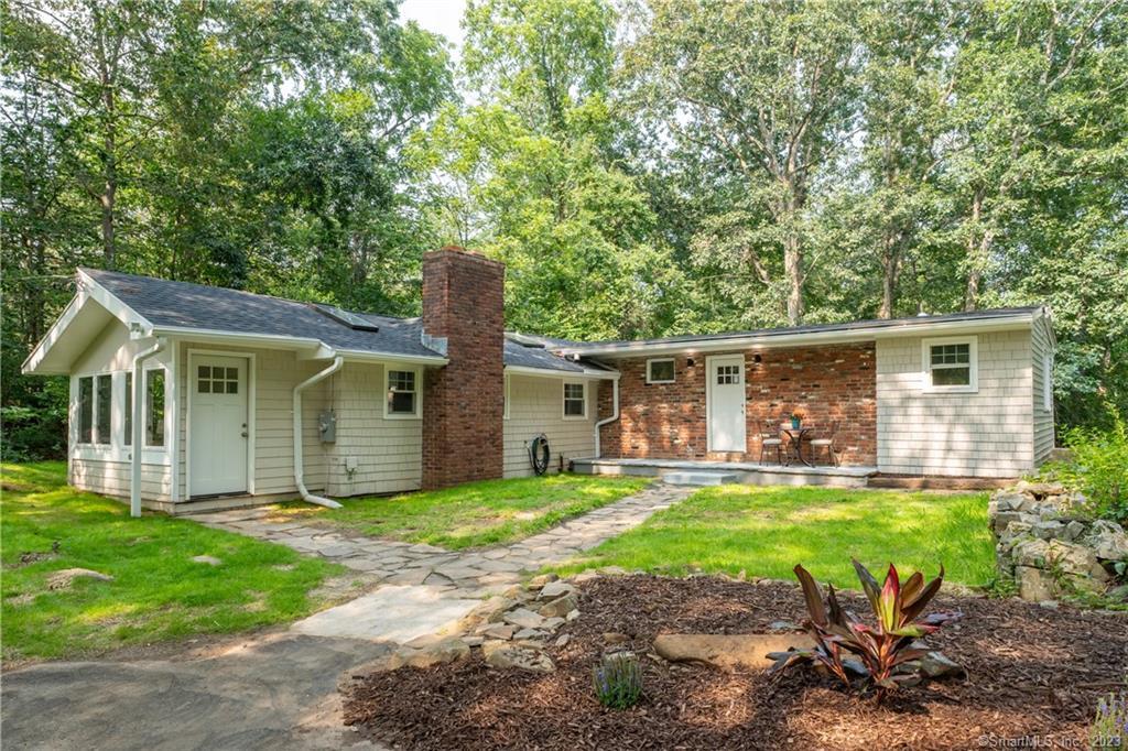 1779 Little Meadow Road Guilford, CT 06437 - Photo 1 of 32 a view of a house with a yard and sitting area