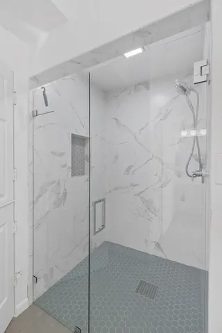 a view of storage and utility room with racks on the wall