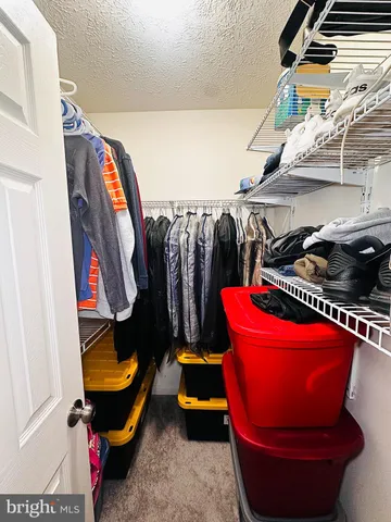 a room with lots of different colored cloths