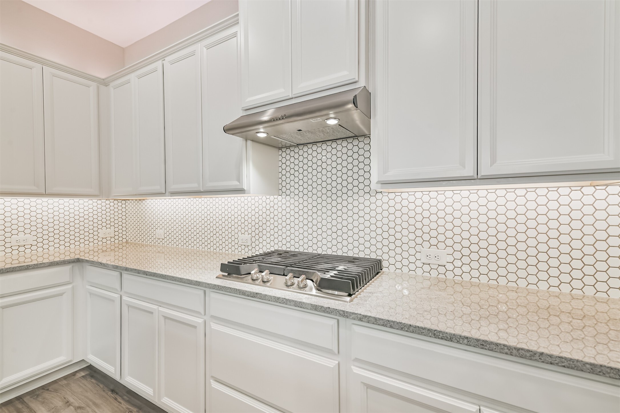 15611 Rising Wren Court Conroe, TX 77302 - Photo 16 of 38 a kitchen with white cabinets and sink