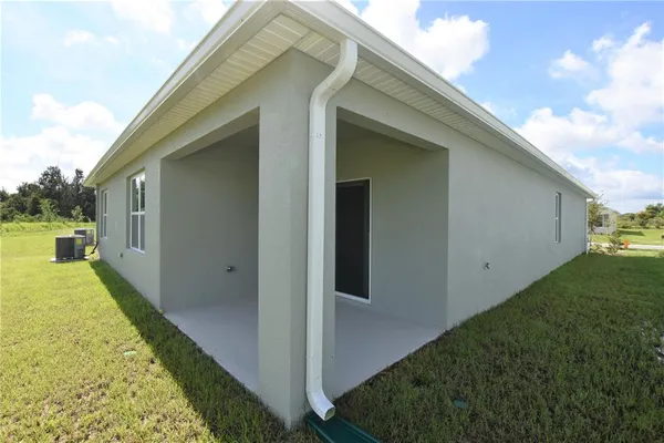 a view of a back yard of the house