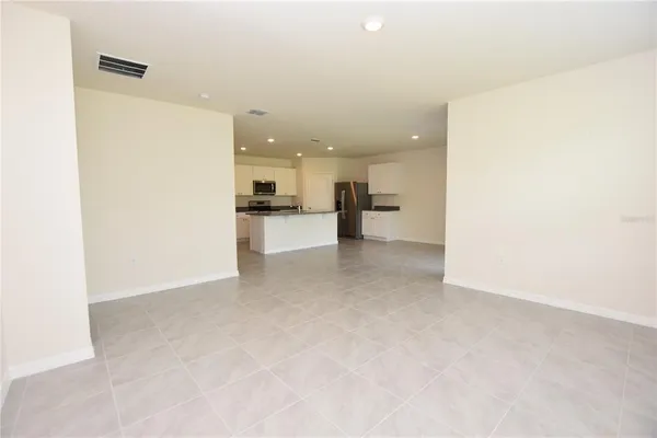a view of a kitchen with a sink and cabinets