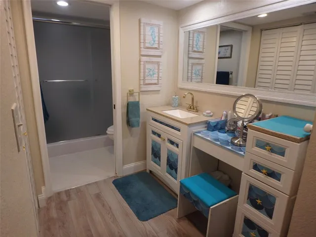 a bathroom with a shower and toilet