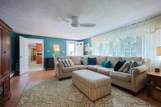 a living room with furniture and a rug