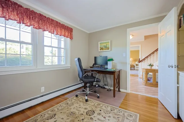 a workspace with furniture and a window