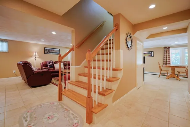 a living room with furniture and a rug